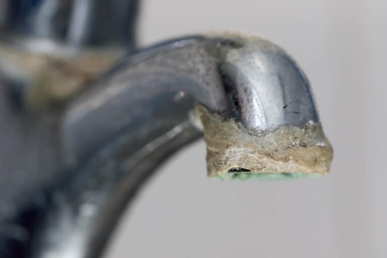 Selective focus on hard water deposit.