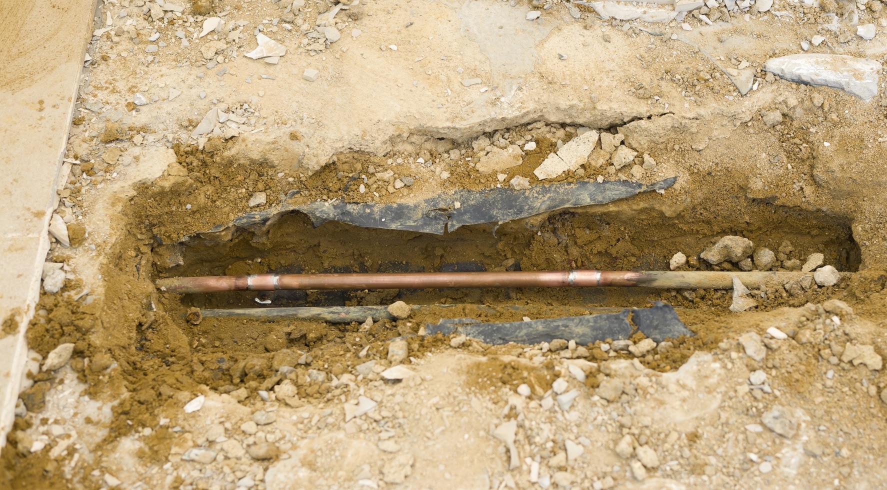 Slab leak repair signs and solutions under floors.